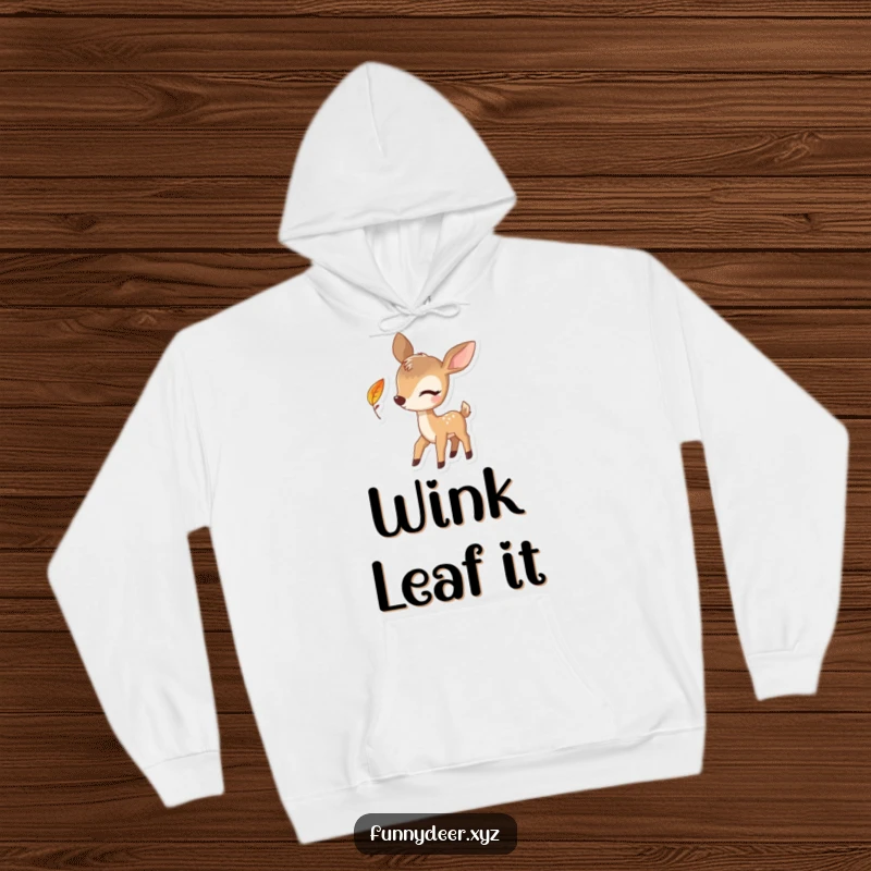Funny Winking Deer Hoodie, featuring a playful deer winking with a falling leaf, perfect for cozy laughs.